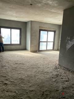 165-meter apartment, semi-finished, in Al-Zohour Compound, Al-Fardous City, in front of Dreamland