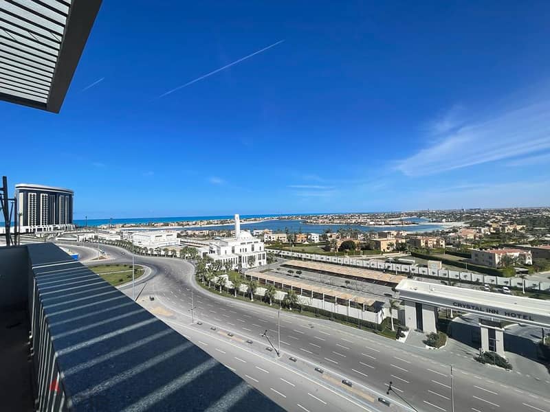 Corner Chalet Panoramic view El Alamein Towers, The Gate Tower and Marina 7 in the most distinguished building in Mazarine 5