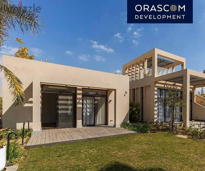 Townhouse Corner for sale in O WEST Compound has a private entrance and is located near Sheikh Zayed City and the 26 Yolo Corridor. 8