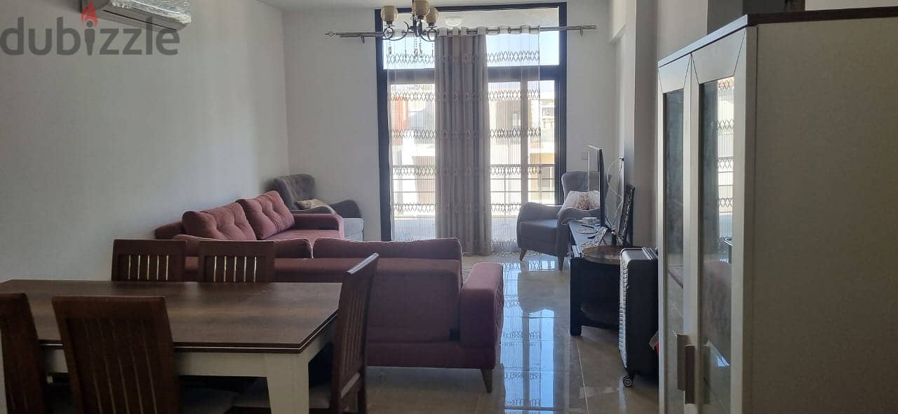 For sale, an apartment with ready to move finished, with air conditioners and kitchen, with a down payment and installments, in Fifth Square 9