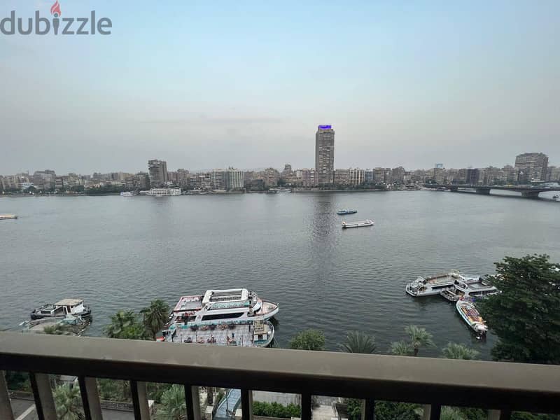 For sale, first row apartment on the Nile, immediate receipt, fully finished, in Nile Pearl Towers, managed by Hilton, in installments. 5
