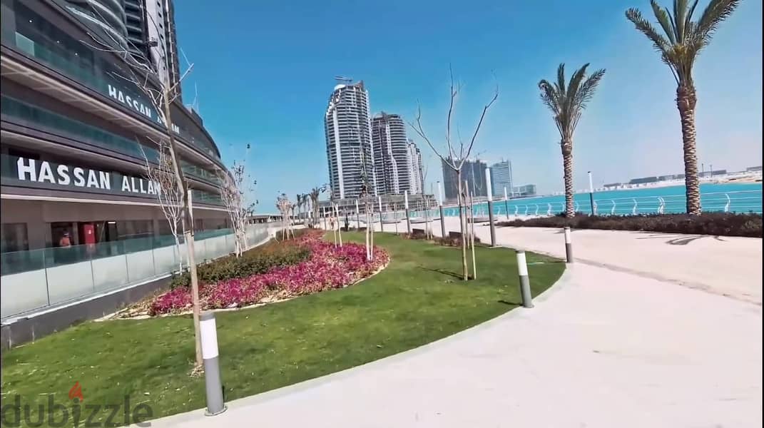 I own an apartment in New Alamein Towers with a panoramic view of the sea and the beach with only 10% down payment 10
