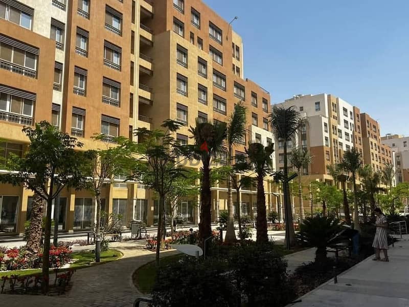 Apartment for sale immediate delivery semi-furnished with kitchen and air conditioners Resale Al Maqsad New Capital Prime location close to services 7