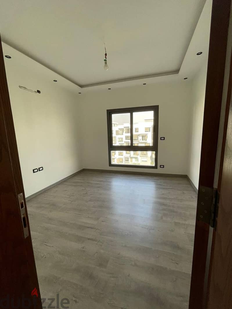 Apartment for sale immediate delivery semi-furnished with kitchen and air conditioners Resale Al Maqsad New Capital Prime location close to services 9