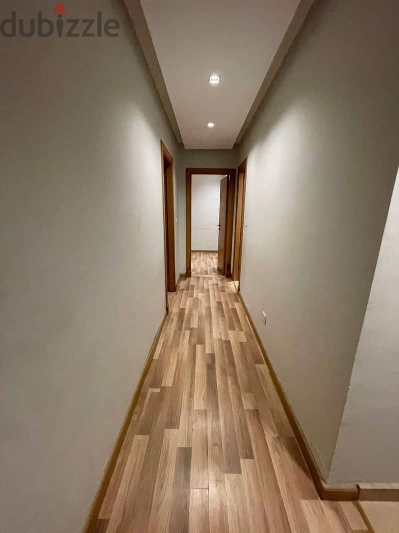 Apartment for sale immediate delivery semi-furnished with kitchen and air conditioners Resale Al Maqsad New Capital Prime location close to services 10