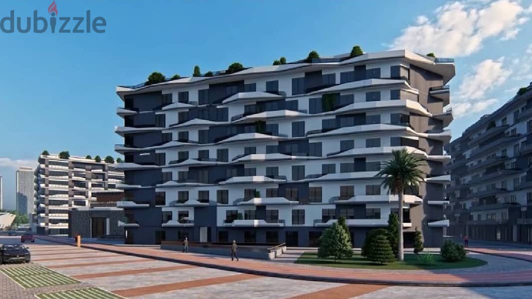 In front of a central garden. . 190 sqm apartment for sale in installments in the Administrative Capital in Roses New Capital 5