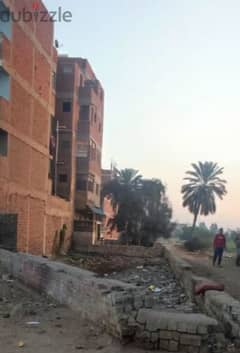 قطعة أرض ناصية كردون مباني علي طريق رئيسي بمنيا القمح 0