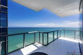 Luxury apartment for sale in El Alamein Towers, elegant finishing, imaginative panoramic view directly on the sea, with hotel services