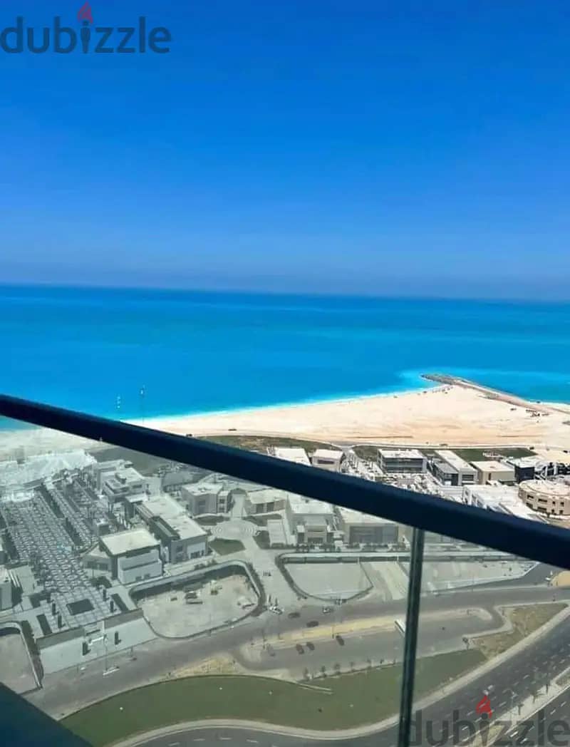 Hotel apartment with luxury finishes for sale in El Alamein Towers, with a panoramic view directly on the sea from all rooms, with a charming view 5
