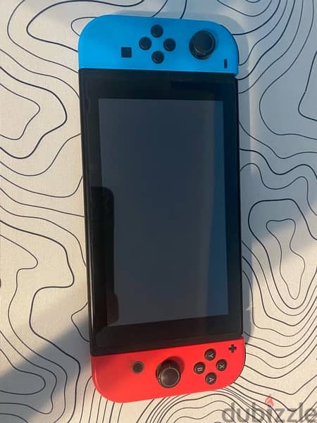 Nintendo switch V2 with 3 games, 2 joysticks and carrier 1