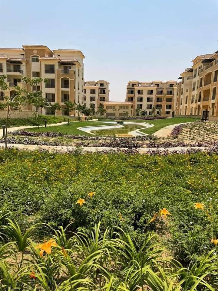 Apartment with garden for sale in the heart of New Cairo, 4 rooms, come down and see for yourself, in installments, one million and 500 thousand are r 8