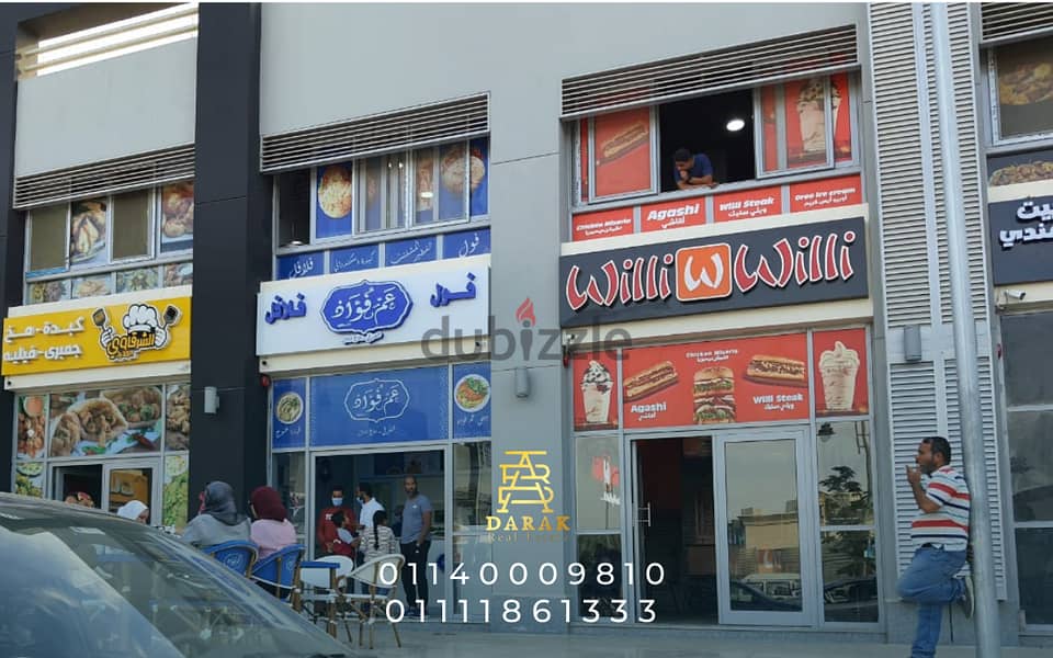 Shop for sale, 76 sqm, rented, first blocks in the Craft Zone, Madinaty, at the entrance to the market and the entrance to East Hub 14
