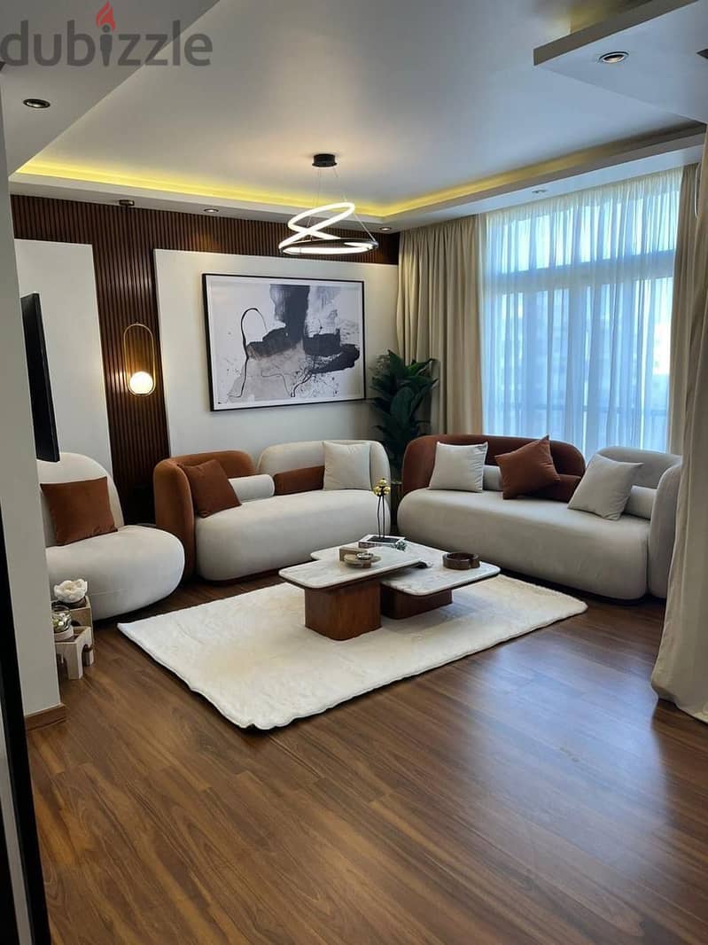 apartment for sale at a 37% discount in front of the airport in the Taj City Compound minutes from Heliopolis and Nasr City in installments over8years 1