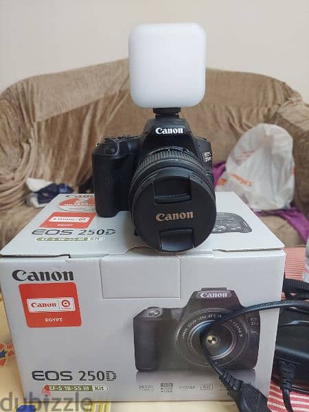 canon 250d + extra battery + light + 2 sd cards + kit lens 4
