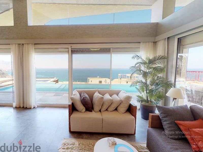 Service apartment for sale [ fully furnished with appliances ] + private garden with a distinctive sea view in Ain Sukhna. 2