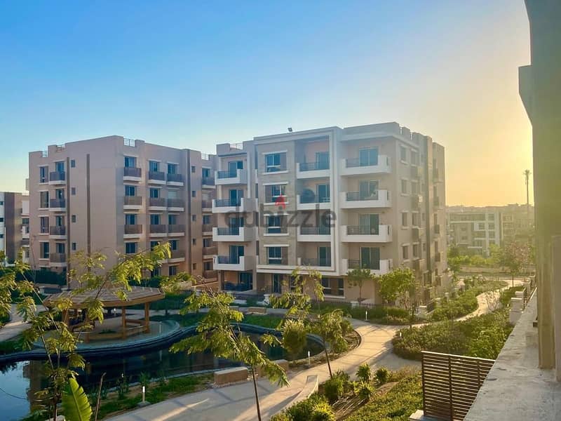 An apartment with a private garden in Taj City Compound, a distinctive location, with a 10% down payment over 8 years, an area of 130 m, a garden 45 7