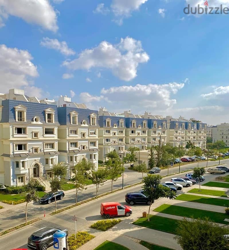 An apartment with a distinctive garden, immediate receipt, with a 15% down payment, in the heart of the Fifth Settlement 1