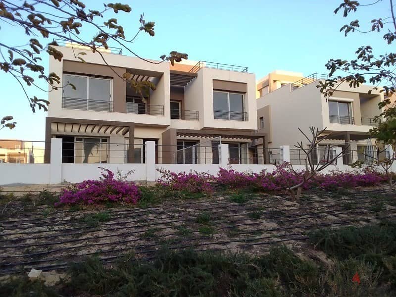 Semi-finished middle townhouse with private roof in Palm Hills, New Cairo  With the best view, the largest open view and landscape 0