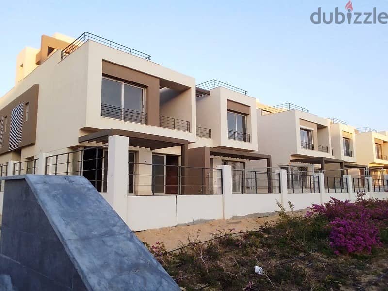 Semi-finished middle townhouse with private roof in Palm Hills, New Cairo  With the best view, the largest open view and landscape 2