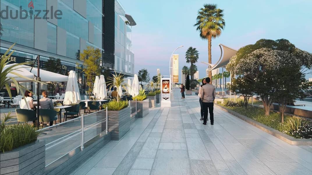 Ground floor store with the lowest down payment and the most distinguished shopping and promenade mall in front of the Al Masa Hotel and the monorail 6