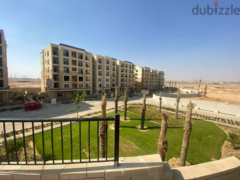 128sqm apartment with a garden with a prime view, ready to move in Sarai Mostakbal City Compound 4