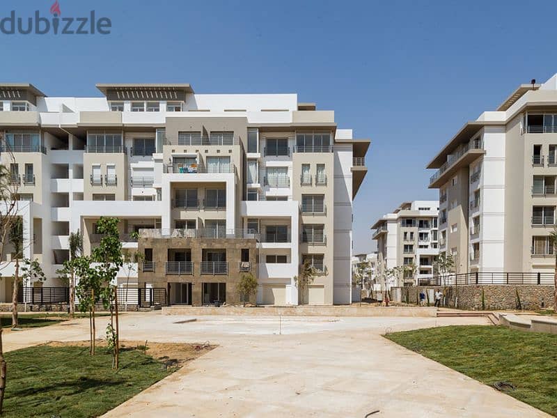 With just a 5% down payment, a luxurious apartment for sale, 159 sqm, with a private garden and a landscape view, available on installment in Hyde Par 7