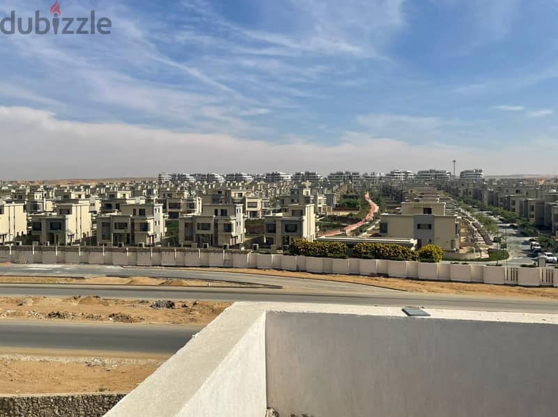 "Own your fully finished apartment for immediate delivery in Galleria Moon Valley compound, Fifth Settlement, with green spaces, landscape, and club 10