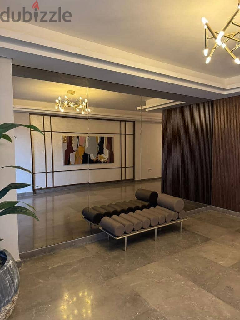 For sale, a finished apartment with air conditioners, with a panoramic view on the landscape, 9th floor in Zed West Towers, Sheikh Zayed, by ORA 4