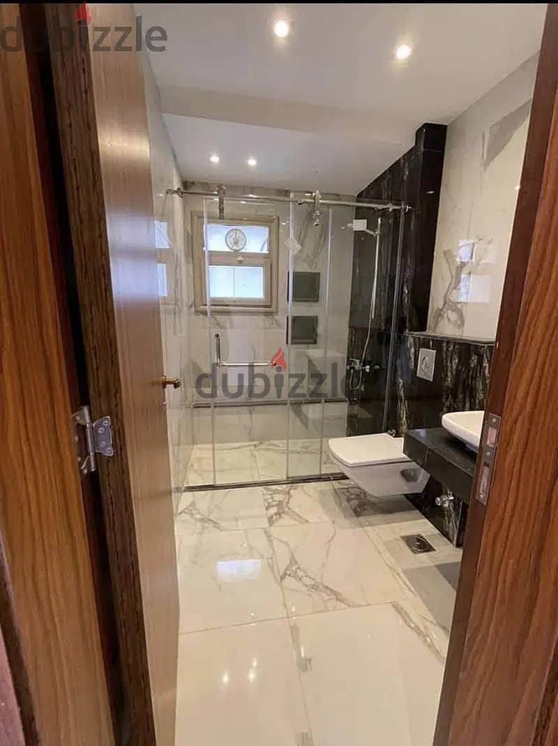 Townhouse villa for sale in 6th of October minutes from mall of Arabia in | Nyoum West October | with a great view on pool and water features 2