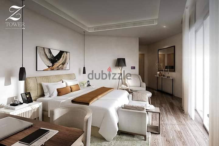 Apartment for sale in Zed Towers, luxuriously finished, ACs and kitchen, in a strategic location in Sheikh Zayed, next to Al Rabwa 3