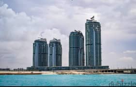 I own an apartment in New Alamein Towers with a panoramic view of the sea and the beach with only 10% down payment 0