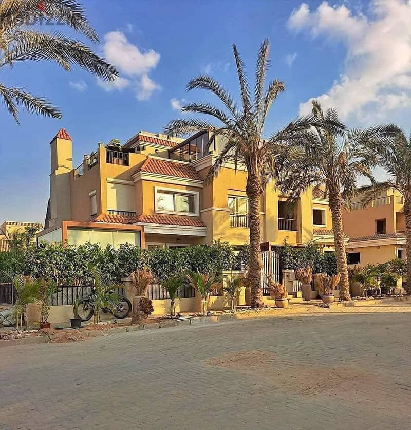 Villa 239 for sale, distinctive location on Suez Road directly next to Madinaty - ground, first and roof 10