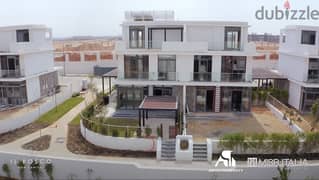 Townhouse villa for sale in Mostakbal City from Tatweer Misr | Il Bosco City | with pentouse + swimming pool view and a panoramic view of lagoon