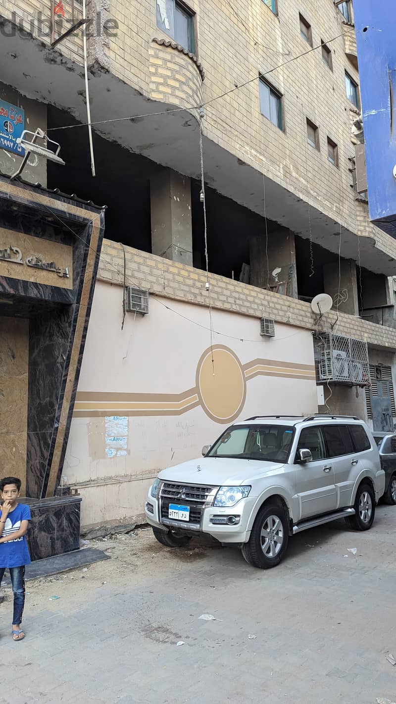 محل تجاري للبيع و مطل على ميدان ترسا و ش عثمان محرم بالطالبية الرئيسي 19