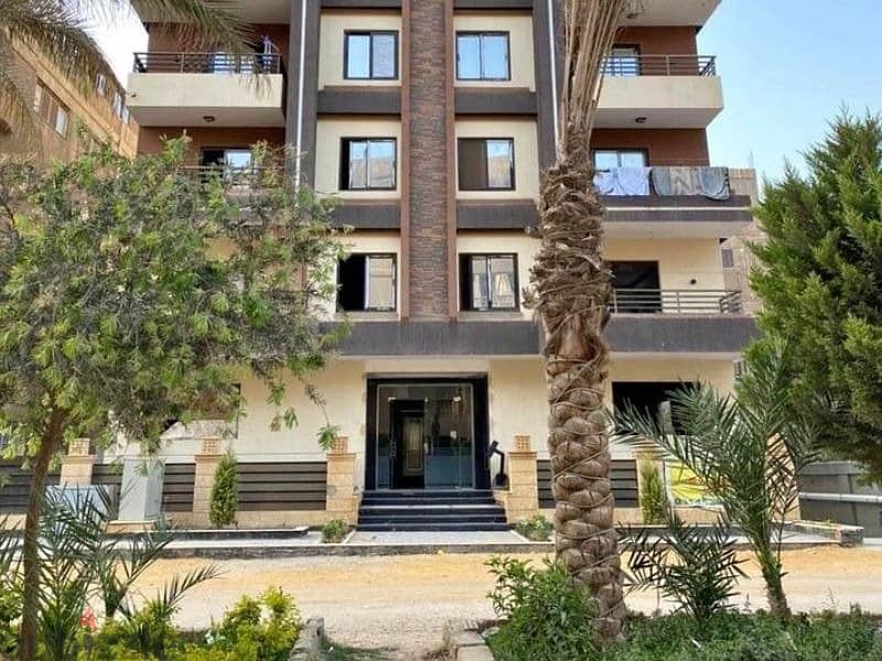 Apartment for sale in installments in a private garden, finished with air conditioners, in a very special location on the landscape in the Revali Comp 2