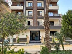 Apartment for sale in installments in a private garden, finished with air conditioners, in a very special location in the Ravalli Compound.