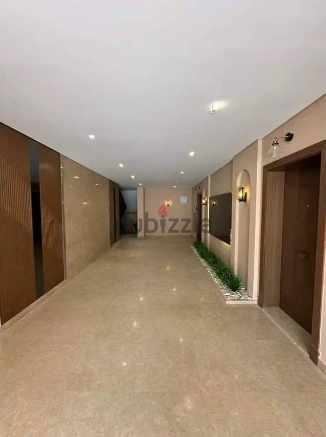 Apartment for sale in the heart of Sheikh Zayed, near Hyper One, in Village West Compound by Dora, fully finished, large area, 4 bedrooms 5