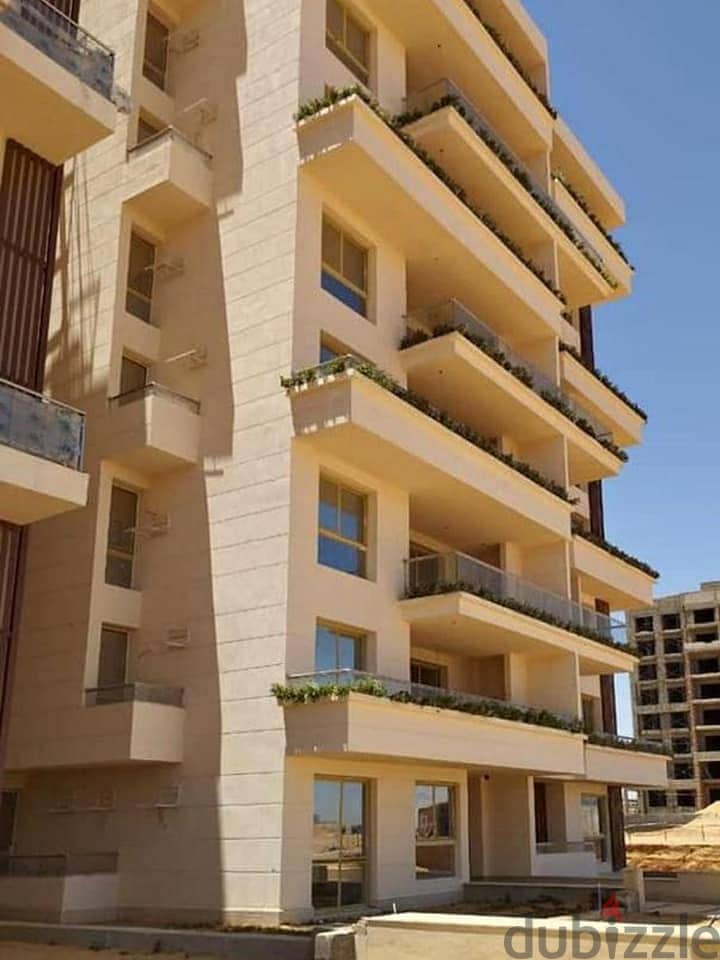 Apartment with private garden for sale in Sheikh Zayed, with a down payment of 888 thousand 8