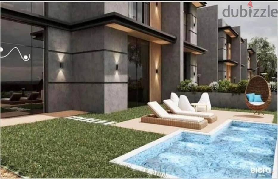 Townhouse 215 m for sale in an excellent location, intersection of Dabaa axis and the middle ring road in New Zayed City, Elora Compound 3