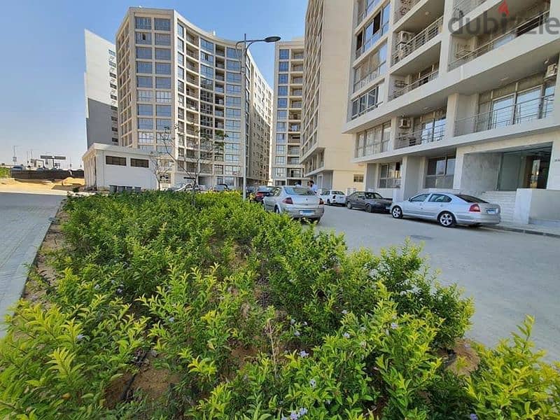 Apartment for sale, 100 meters, with a private garden of 15 meters, completed in installments, in One Katameya Compound 1