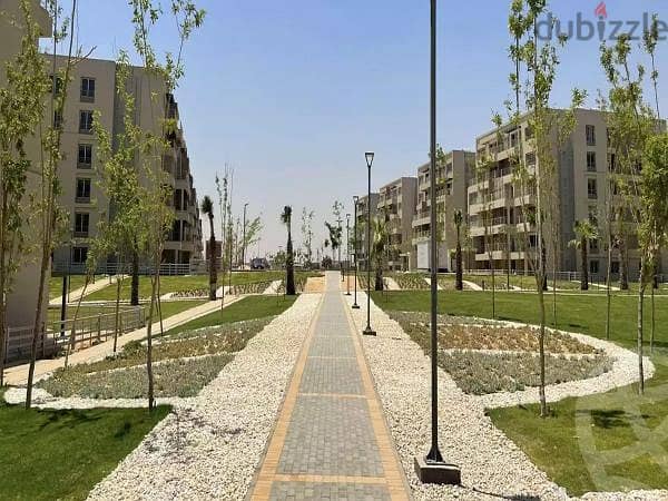 apartment with garden fully finished direct on lagoon , palm hills new cairo cleo 5