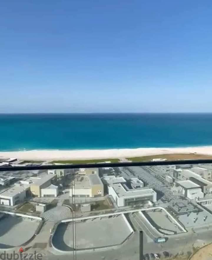 Apartment for sale in Double View Lagoon and Sea, fully finished, in New Alamein Towers 8
