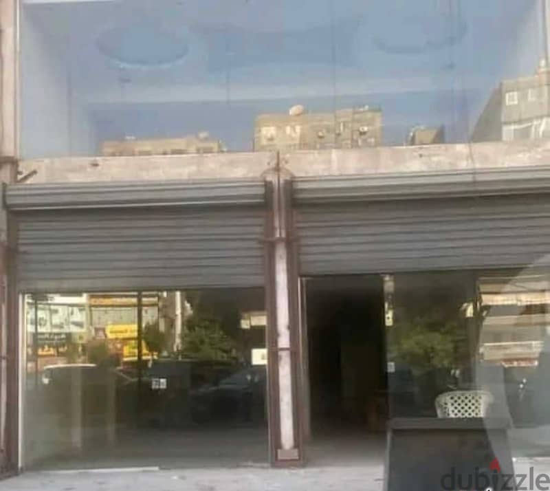 A snapshot of a commercial ground floor shop for sale (51 m + 33 m outdoor), facing directly on the desert road in Sheikh Zayed, in front of Sphinx Ai 1