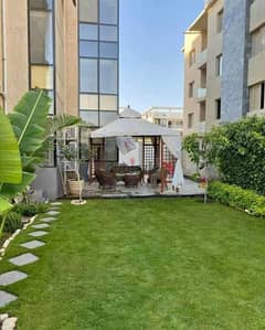Apartment for sale with garden in Trio Gardens Compound in Golden Square, New Cairo