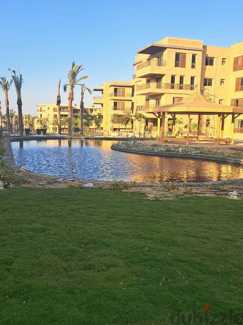 Double view apartment in Taj City Compound, area of 166 square meters, for sale at a special price, view pool, in front of Cairo Airport 5
