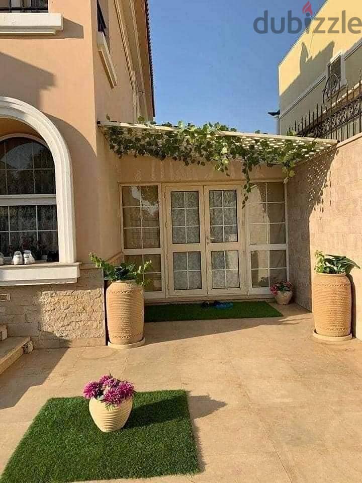 Independent villa 175 sqm + garden 180 sqm and roof 54 sqm for sale in Sarai Compound, New Cairo City Wall 20