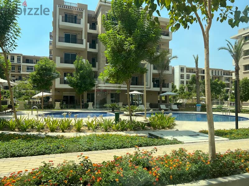 Your apartment on the view garden in Taj City Compound, area of 130 square meters, two very special rooms, for sale with a 5% down payment and install 17