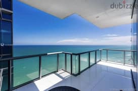 Luxury apartment for sale in El Alamein Towers, elegant finishing, imaginative panoramic view directly on the sea, with hotel services 0