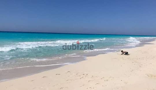 Land for sale in the most beautiful beaches of the world, Marsa Matrouh city, first row to the sea, an area of ​​12 acres, on which 22 villas are buil 1