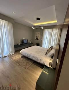 For sale, an apartment with a garden, in installments, finished with air conditioning, in Amaze Location, Sheikh Zayed, from Dorra in Village West.
